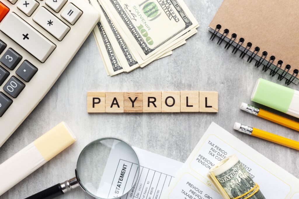 top view payroll concept with items min